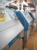 Drei Rüter-Walzenstühle in einer Maismühle